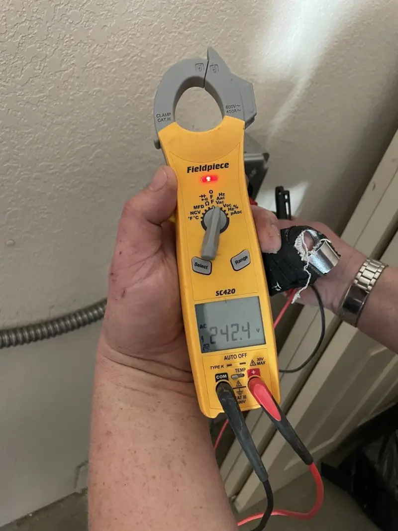 Voltage testing with clamp meter during Circuit Breaker Repair in Bayville
